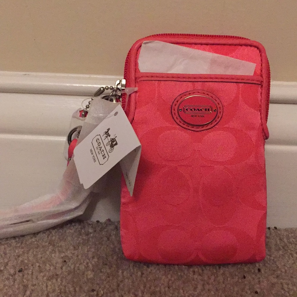 Coach signature nylon phone wristlet.